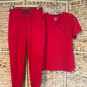 Beyond Scrubs Red Scrub Set with V-Neck top and jogger bottom.